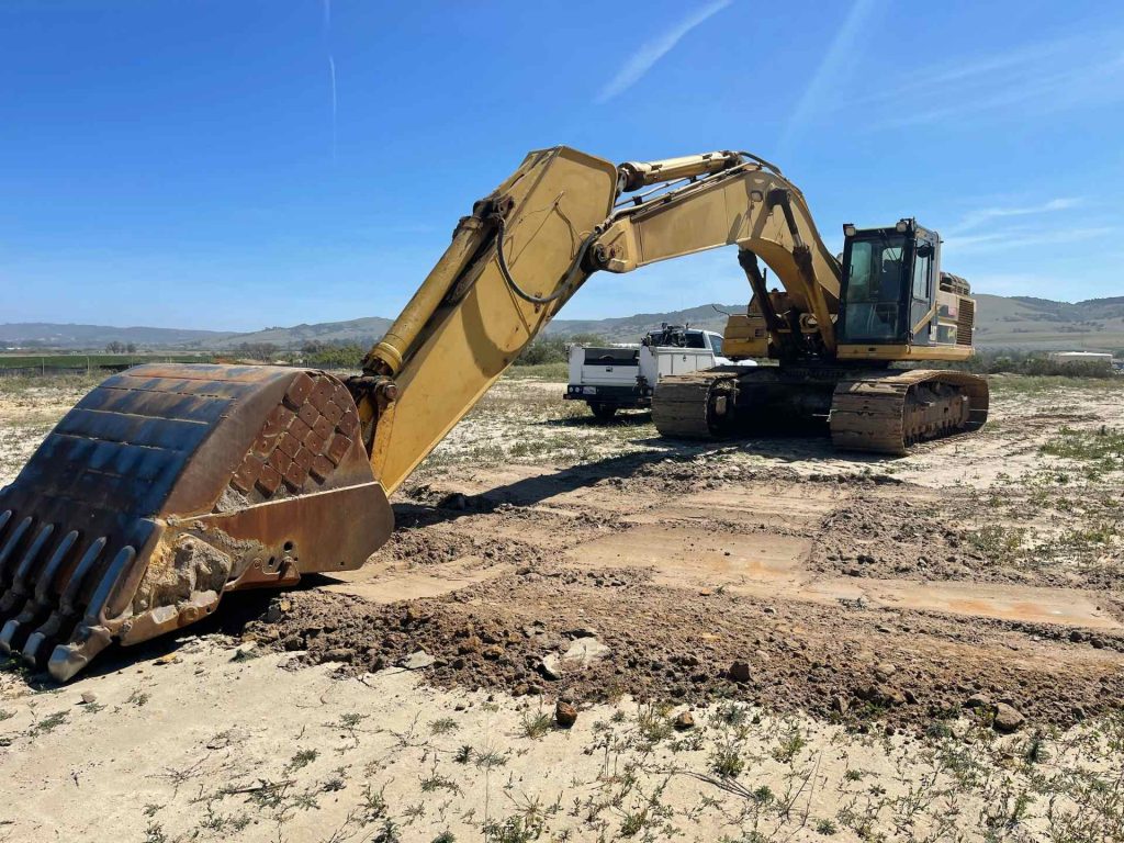 Excavator on a construction site, sunny day