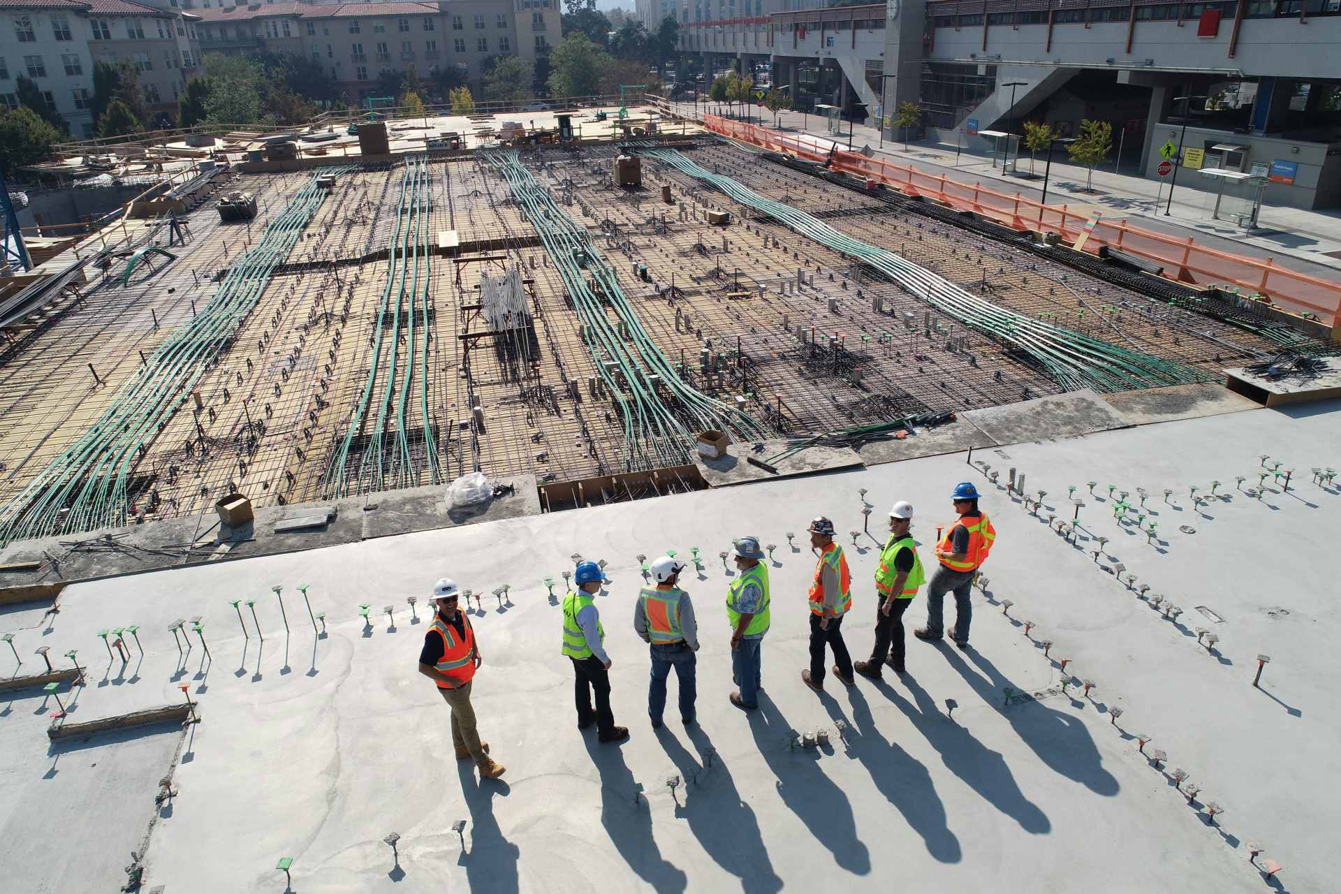 Workers inspecting large-scale construction site